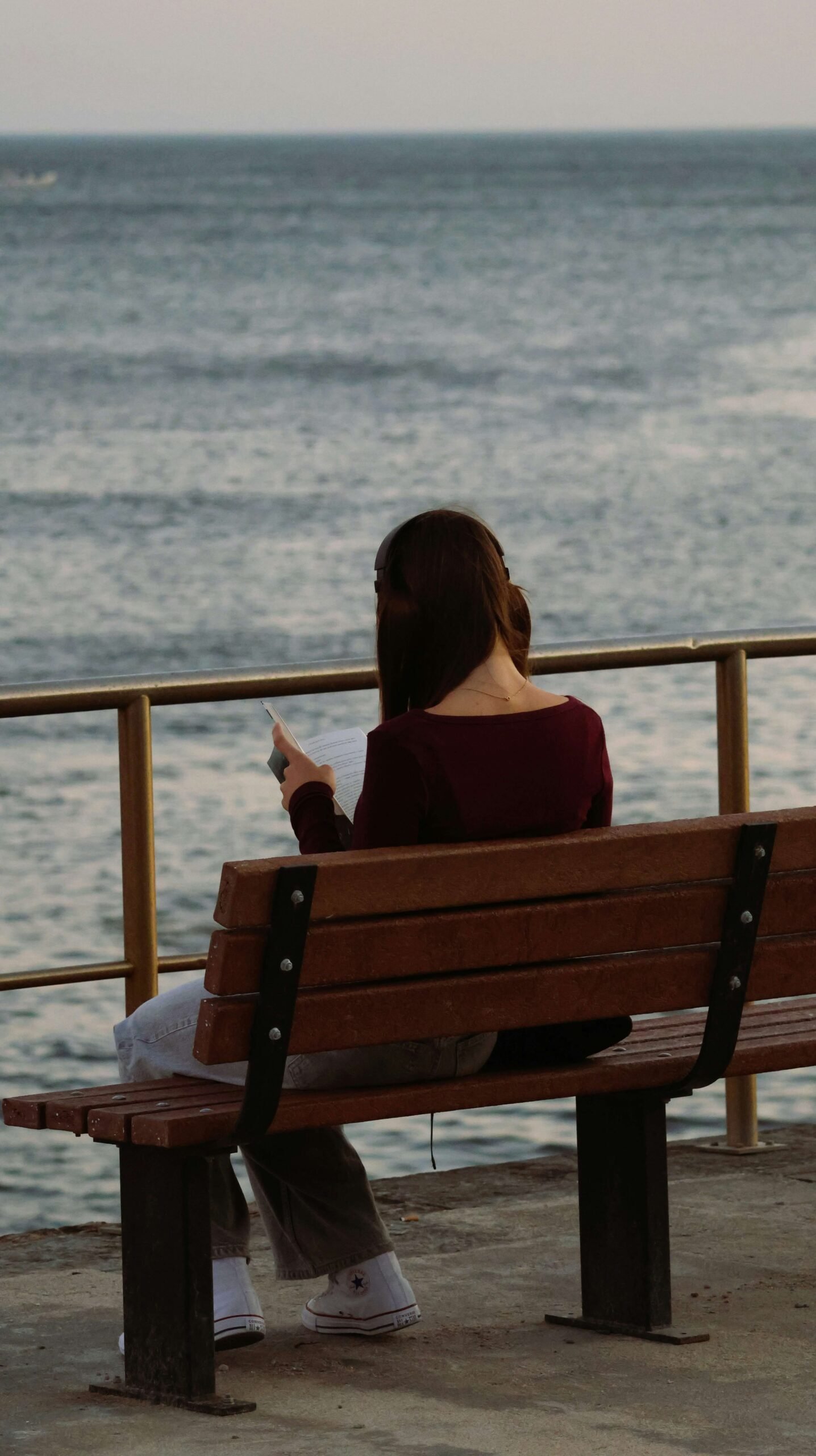 Woman sitting alone, representing waiting for someone who isn’t emotionally ready.
